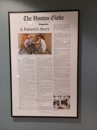 A Patient's Story, the Boston Globe newspaper article about Kenneth Schwartz, hangs on the wall at the Schwartz Center for Compassionate Healthcare
